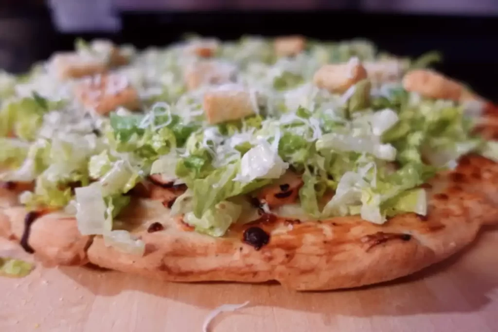side-view-chicken-caesar-salad-pizza