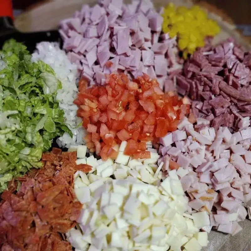 ingredients for hoagie dip chopped on plater