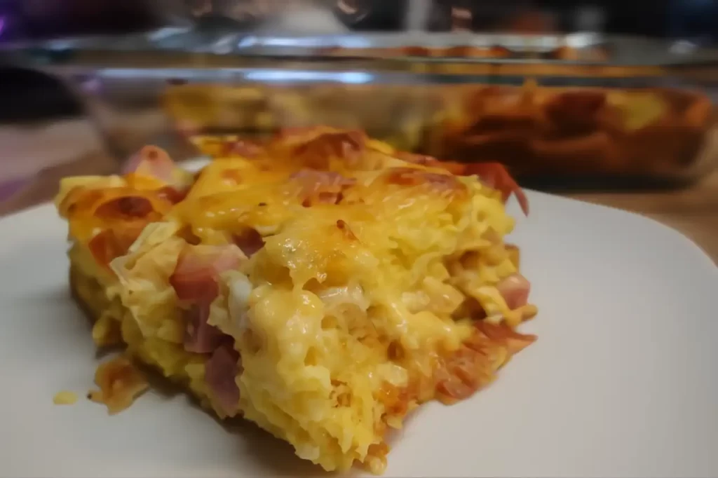 serving-of-overnight-breakfast-casserole-on-white-plate.