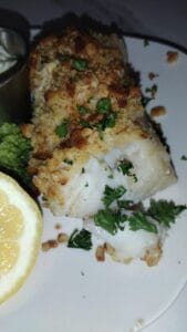 baked haddock with lemon on a plate