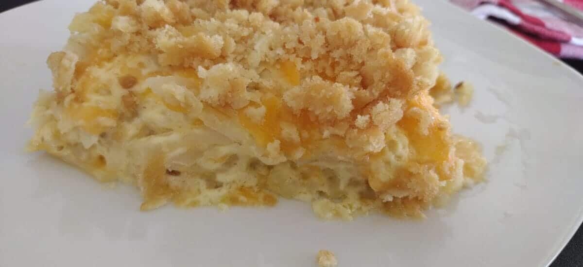 cheesy hashbrown casserole on a plate with