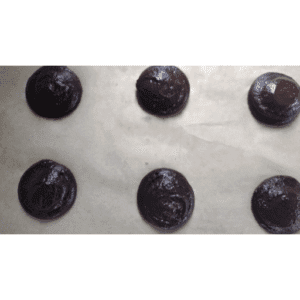 chocolate whoopie pies on baking sheet ready to be baked