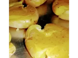 smashed baby potatoes on cookie sheet for smashed garlic potato recipe