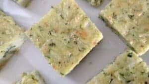 zucchinicious bars-zucchini bars on white plate