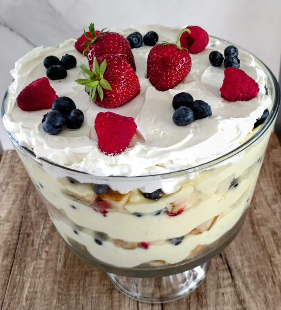 3 berry trifle on wooden table