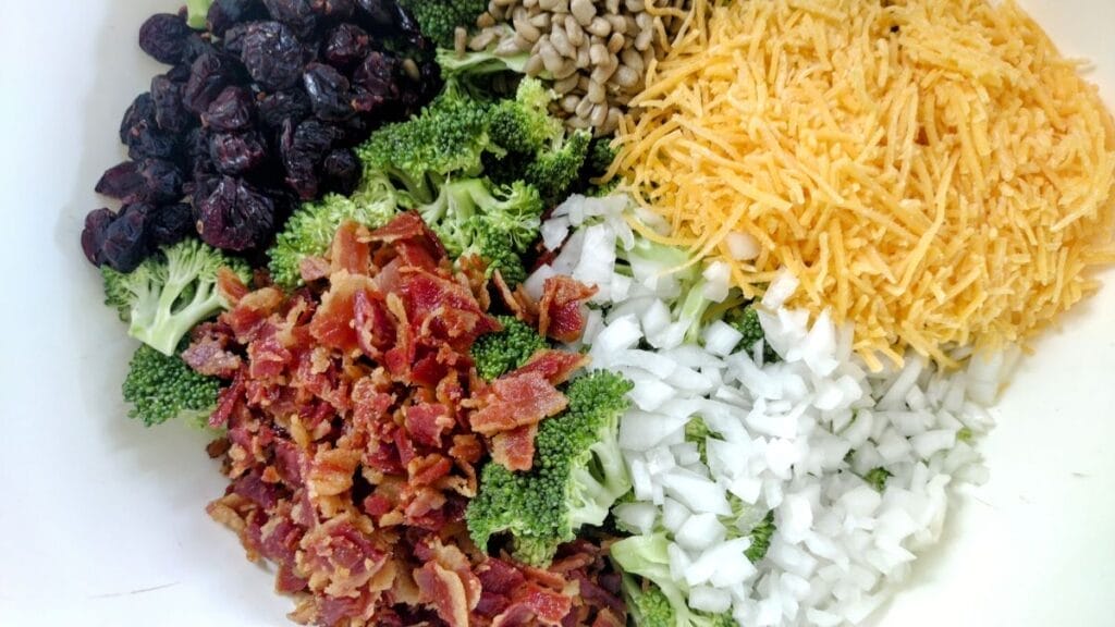 broccoli salad ingredients bacon, onion, cheddar cheese,cranberries, sunflower seeds, broccoli