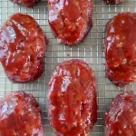 glazed meatloaves on baking rack