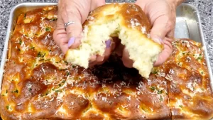 tearing-a-piece-of-focaccia-bread.