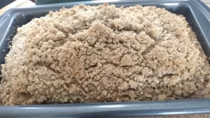 zucchini bread baked in bread pan with streusel topping