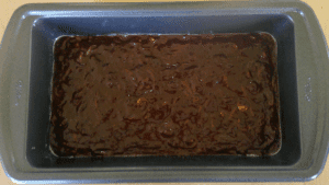 chocolate peanut butter zucchini batter in 9 x 5 loaf pan ready to bake