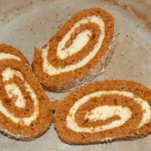 3 pumpkin roll slices on a tray