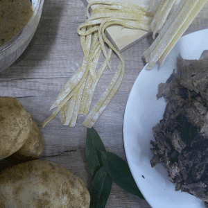 Roast beef, beef stock, homemade noodles and potatoes ingredients for noodles and beef