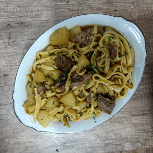 beef & noodles in white dish