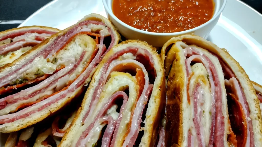 up-close-stromboli-on-plate-with-marinara