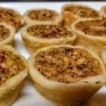 pecan tarts on white serving tray