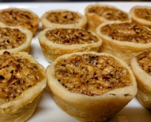 pecan tarts on white serving tray