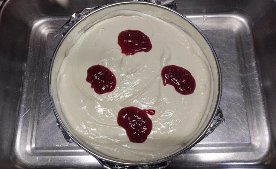 cheesecake with dollops of cherry filling