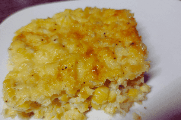 serving of the ultimate baked corn recipe on a white plate