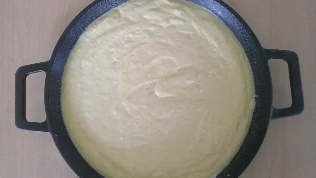 cornbread batter in cast iron skillet