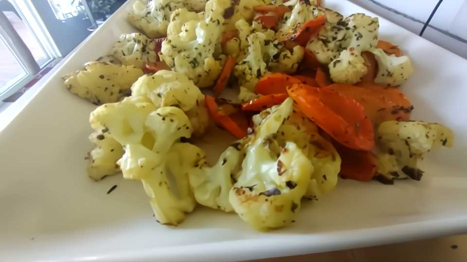 roasted cauliflower with carrots recipe on white tray