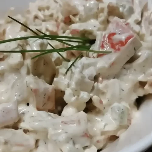 seafood salad recipe in a white serving bowl