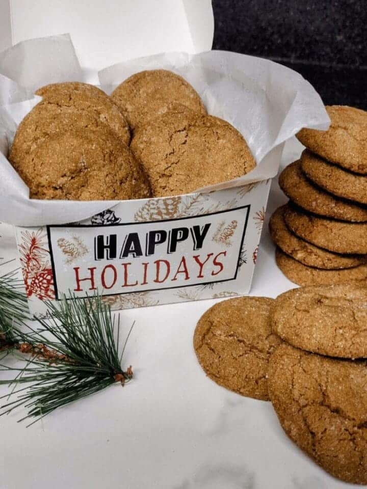 molasses cookies in gift box that says happy holidays