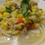 chicken corn soup in a white bowl