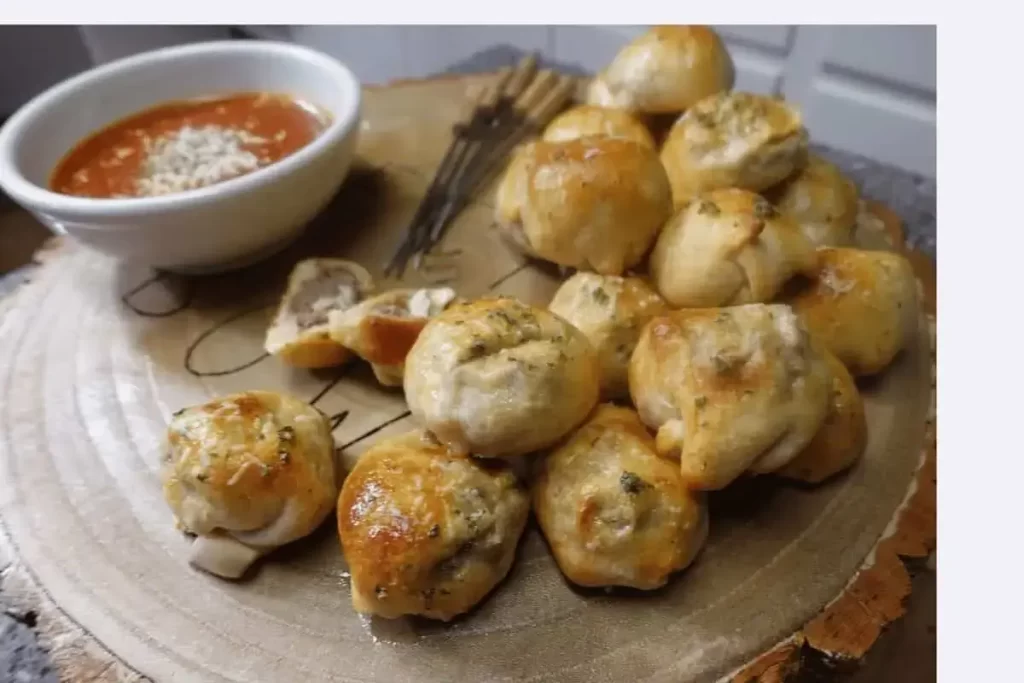 meatball bombs on platter with dipping sauce