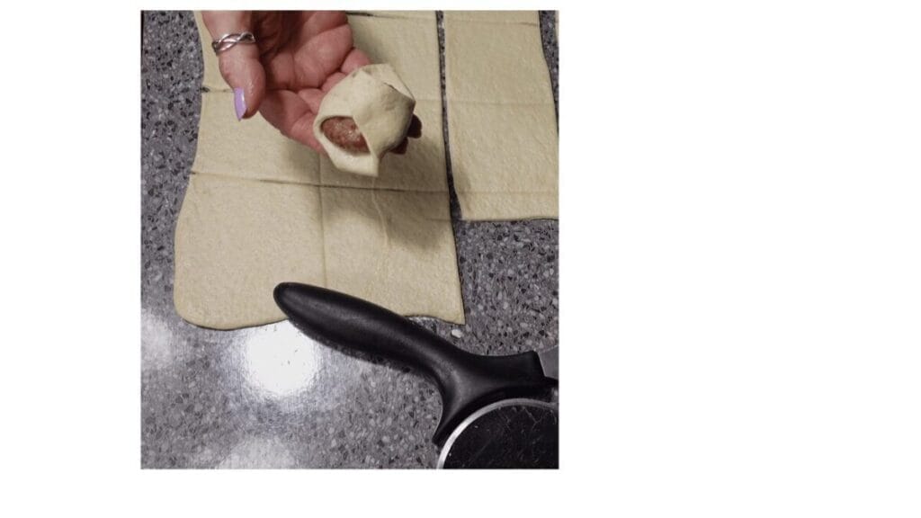 meatball bombs being wrapped in pizza dough