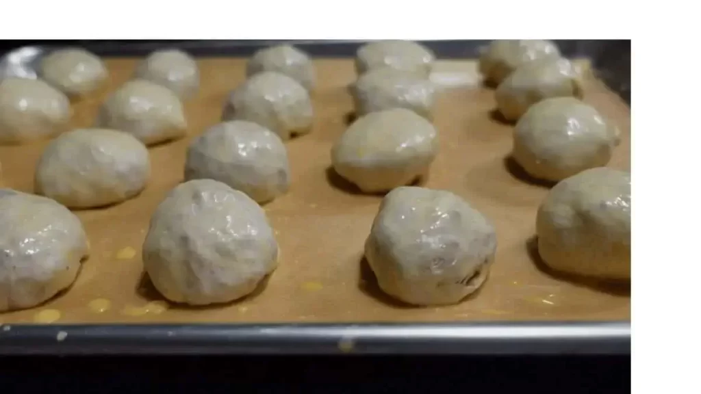 meatballs wrapped in dough ready to be baked for meatball bombs