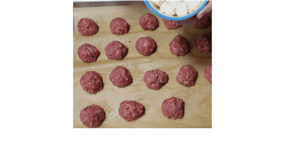 meatballs on tray stufed with mozzarella cheese