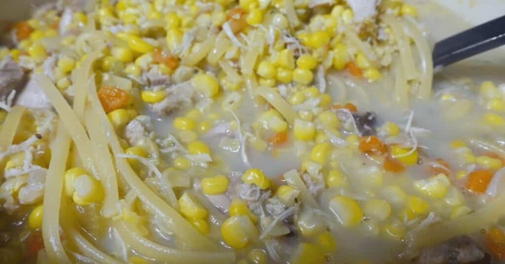 chicken corn soup in pan simmering