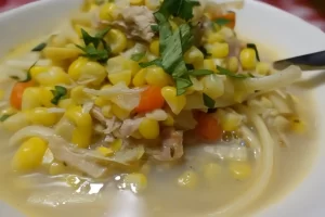 chicken-corn-soup-in-bowl-with-parsley-garnish.