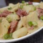 pot pie in serving dish with sliced green onions