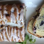 top view blueberry pound cake drizzled with glaze