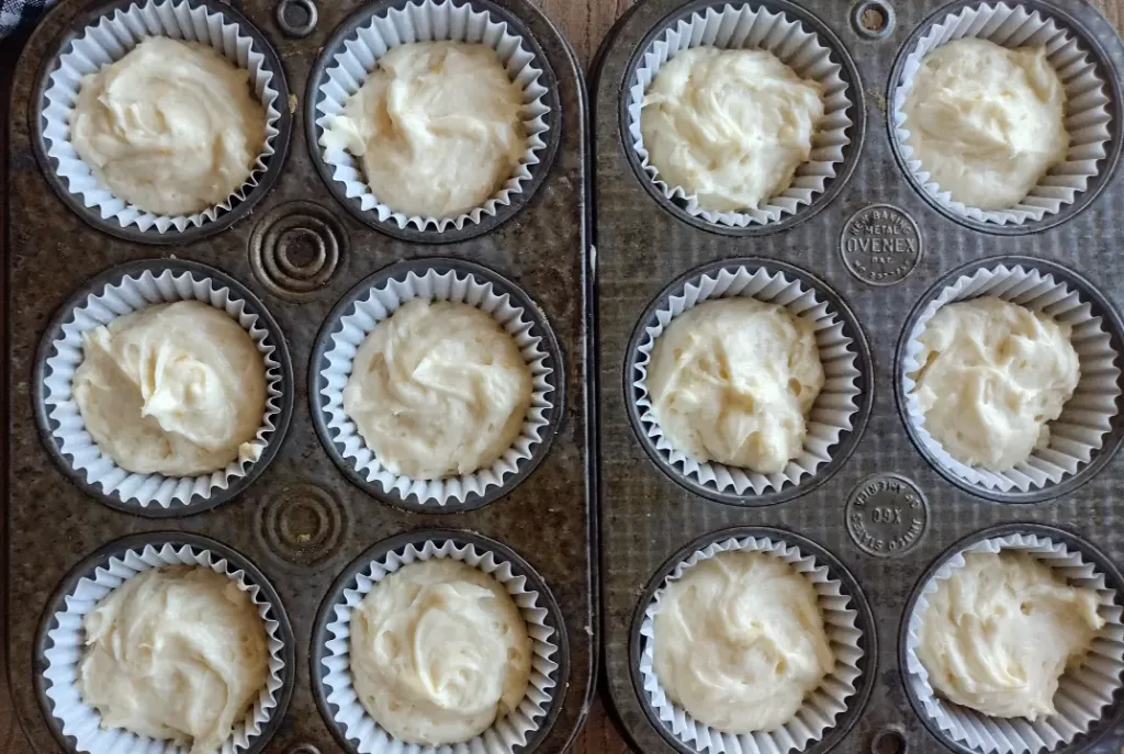 orange creamsicle cupcake batter in cupcake tins