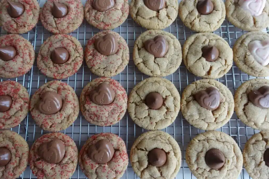 peanut butter blossoms cookies on a cooling rack 