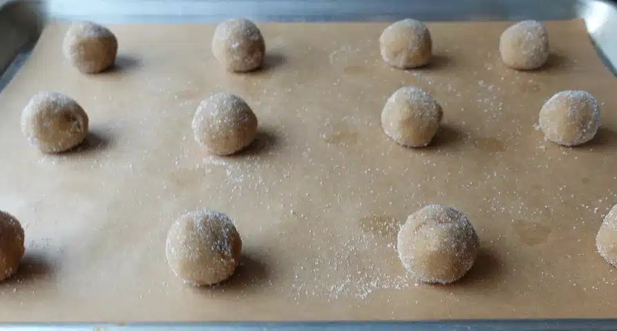 peanut butter cookie dough balls on tray ready for oven