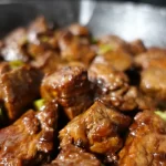 sweet and spicy steak bites in cast iron skillet