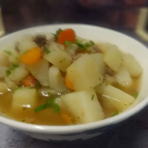 potato soup with hamburg in white bowl