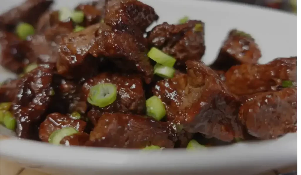 sweet-and-spicy-steak-bites-on-white-plate