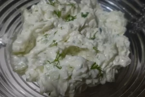 cucumber onion dip recipe in clear bowl