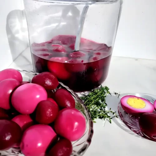 pickled egg recipe with red beets in gallon jar and serving dish