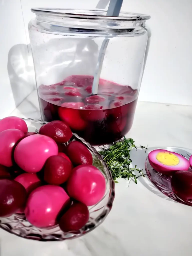 pickled egg recipe with red beets in gallon jar and serving dish