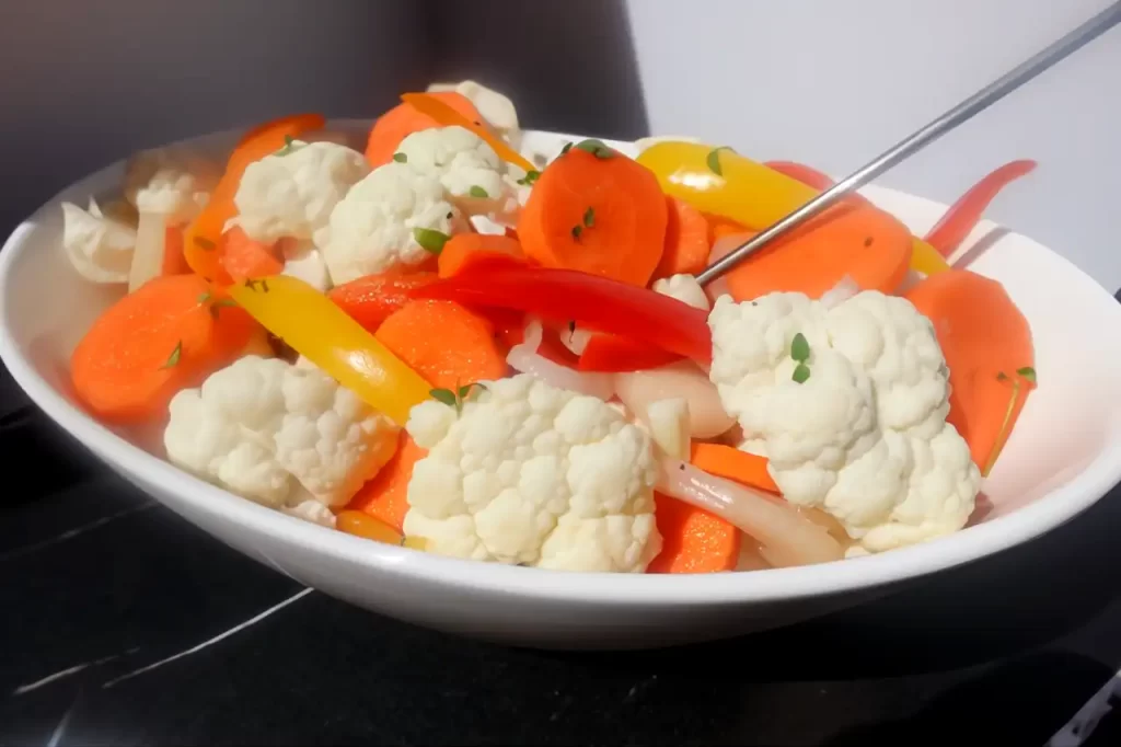 pickled vegetables in white serving bowl