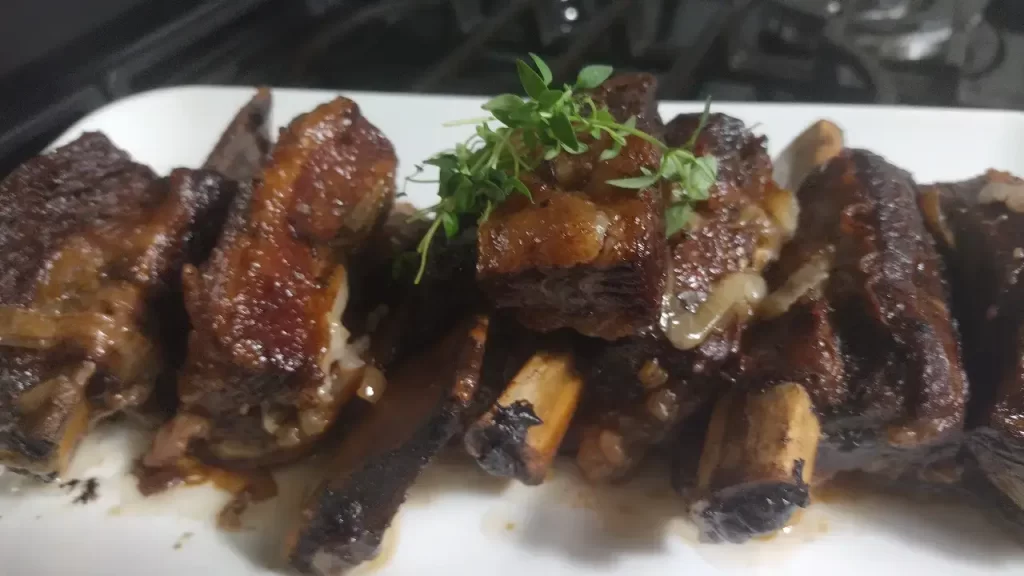 braised beef short ribs recipe on white serving plate