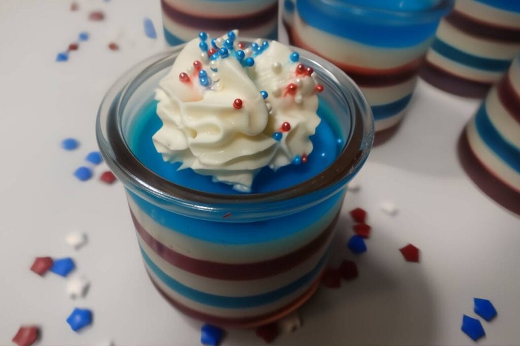 jello cup red white and blue with whipped topping and sprinkles