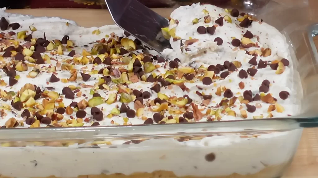 removing a slice of cannoli dessert bars