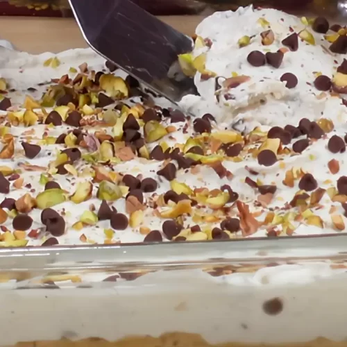 removing a slice of cannoli dessert bars