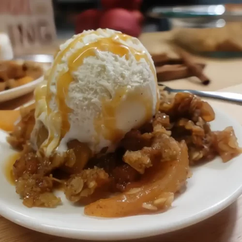 apple crisp with vanilla ice cream and caramel sauce